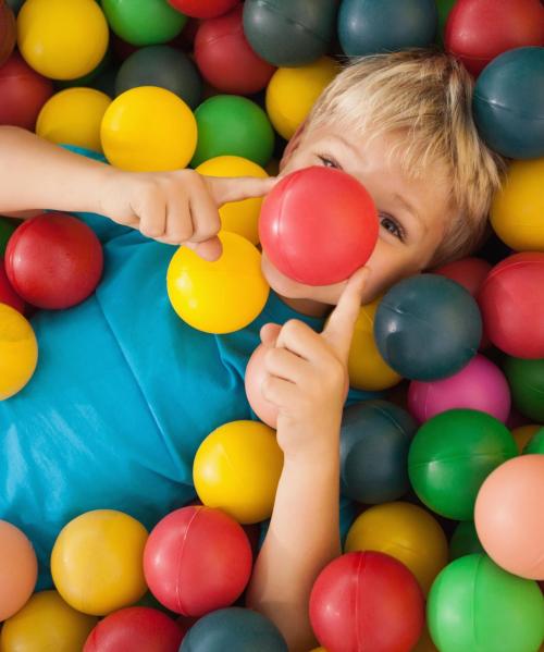 happy-boy-playing-ball-pool-min happy-boy-playing-ball-pool-min